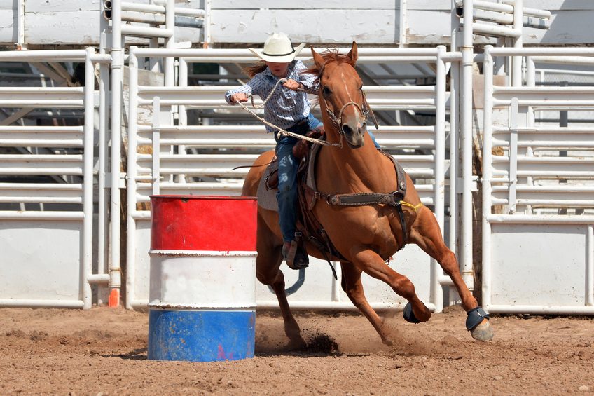 Young Cowgirl Barrel Racing