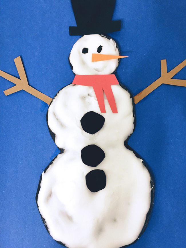 A completed puffy paint snowman craft.