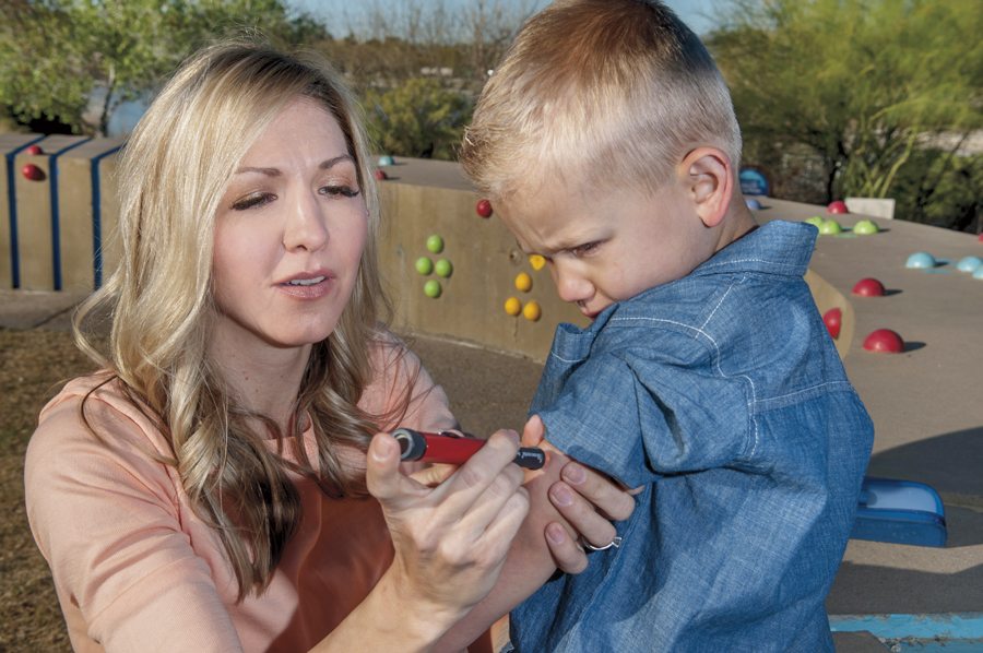 Kimberly Tait gives Jackson (3) an insulin shot. Photos by Rick D'Elia.
