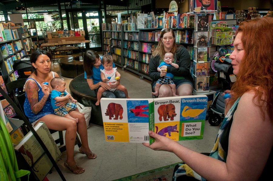 Right: Katy Spratt, an early literacy specialist, from Phoenix Public Library and First Things First, leads BabyTime at Changing Hands Bookstore, Phoenix.