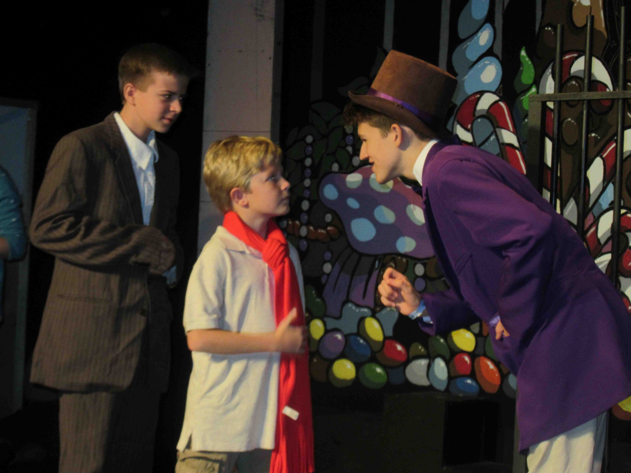Evan Culbertson as Grandpa Joe, Corban Adams as Charlie Bucket and Foster Hilding as chocolate factory owner Willy Wonka in “Willy Wonka Jr.” at Spotlight Youth Theatre Sept. 2–18. 