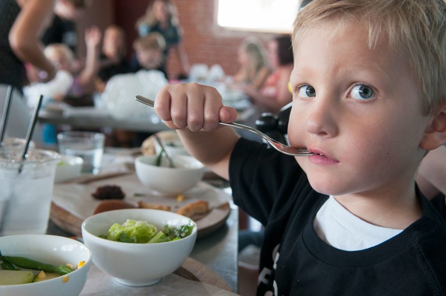 Owen Larsen (5), try some of Chef Aaron Chamberlin's creations at St. Francis Restaurant at a taste test for kids. Photos by Rick D'Elia.