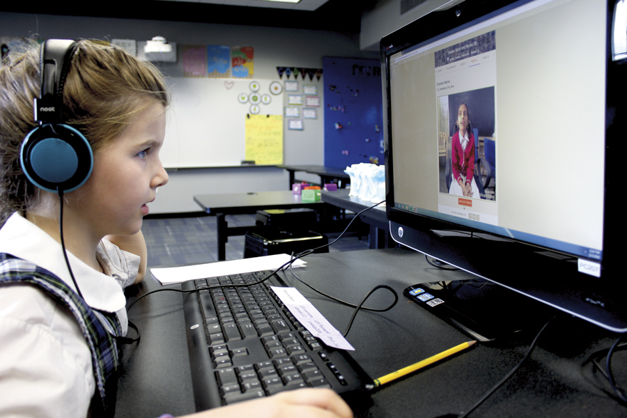 Nora O’Donovan of All Saints’ Episcopal Day School chats with her video-exchange partner Keerthana in Bangalore, India.