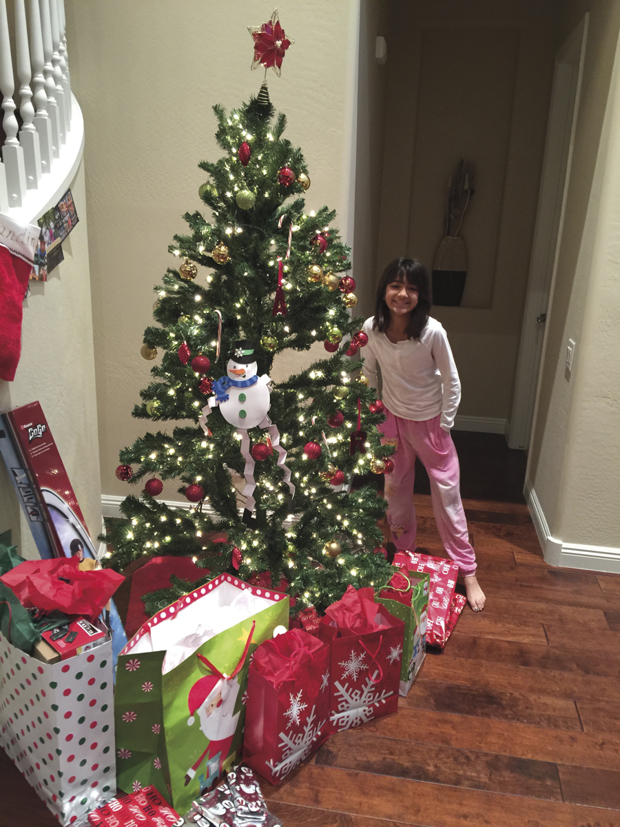 Nandini beams in anticipation of opening Christmas presents. 