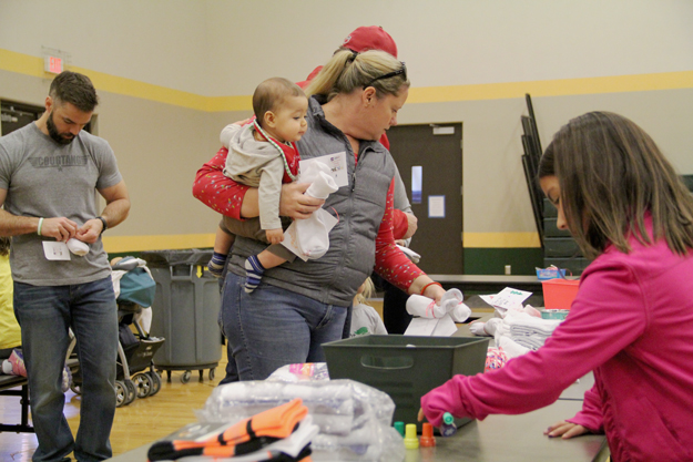 Socks From Santa, Families Giving Back, Central Arizona Shelter Services, Raising Arizona Kids, family volunteering, Phoenix, Arizona