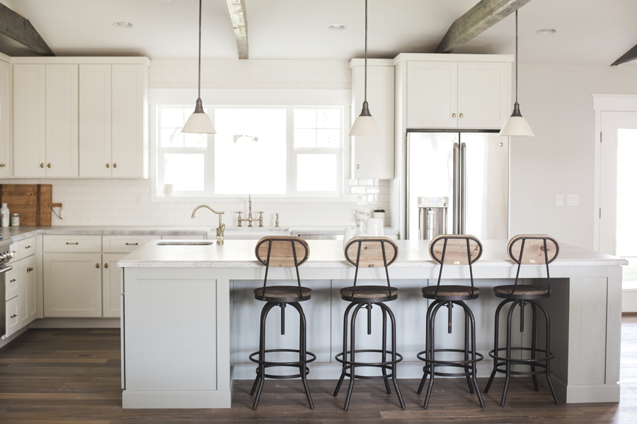 Open kitchens with oversize islands that serve as gathering places.