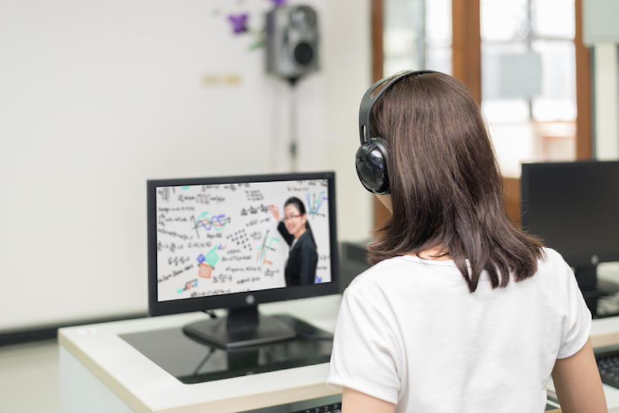Asian woman student video conference e-learning with teacher on computer in IT room at university. E-learning ,online ,education concept.