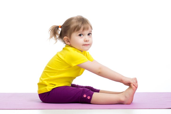 Child girl doing gymnastic exercises