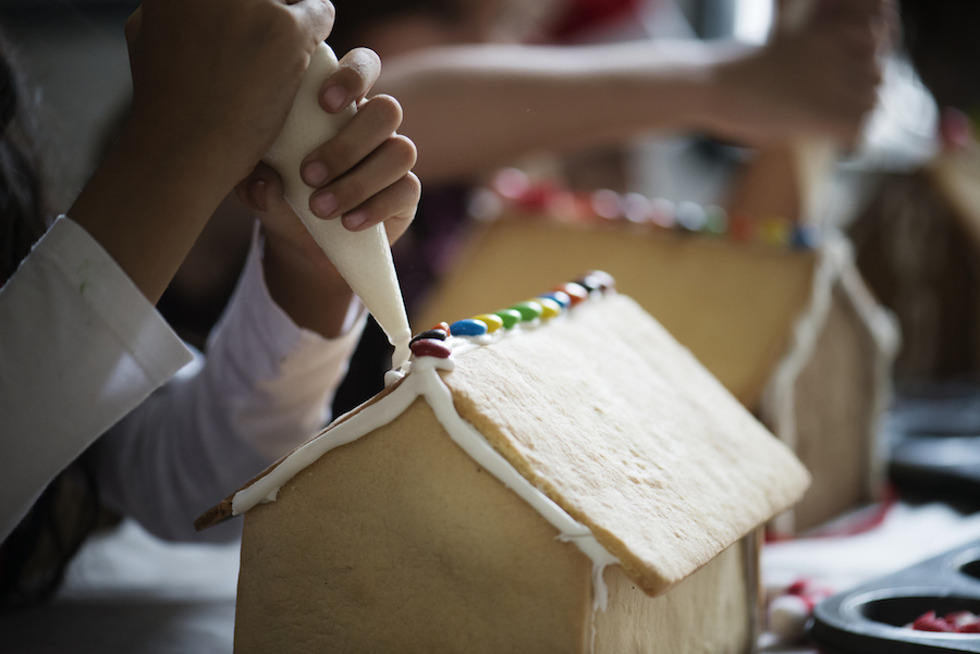 Kids making gingerbread houses