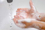 A person using soap to wash their hands